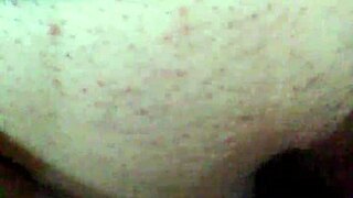 Bound girl masturbates with black dildo under mask 😈