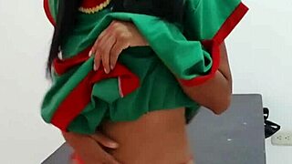 I am celebrating christmas with my christmas suit little by little i am taking off my clothes while i dance sexy on the desk.