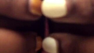 Ebony babe teasing with striptease in public bathroom