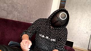 Squid game jerk off on member's dick, cum on tits.