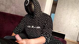 Squid game jerk off on member's dick, cum on tits.
