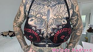 Melody Radford tries on black and purple lingerie and micro bikini.