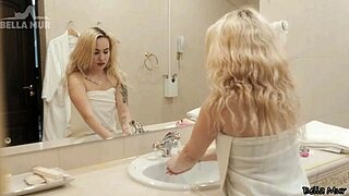This blonde girl with tattoos and a bubble butt is bathing and using a dildo on her pussy