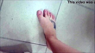 Wonderful sexy feet trying on sandals in the shoe shop