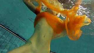 Nastya strips and shows her naked body in the pool