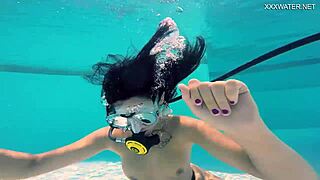 brita piskova dives underwater in the swimming pool. the teen 18+ masturbates solo.