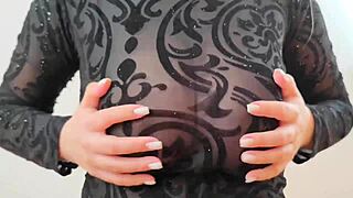 wearing sweatshirt revealing large breasts and nipples